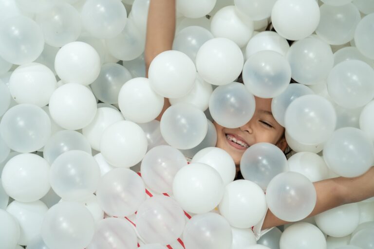GIRL IN BALL PIT