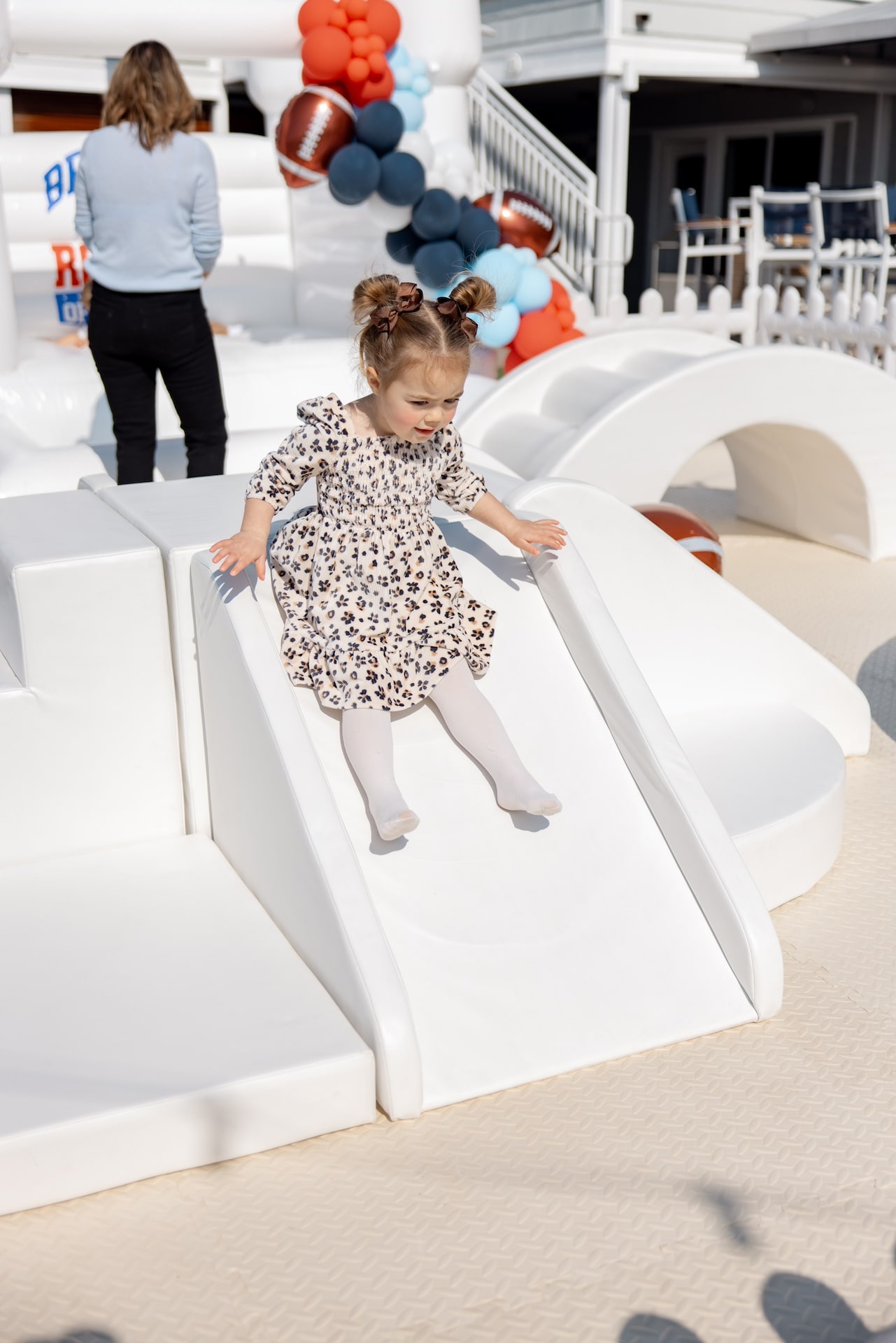 Girl sliding on soft play