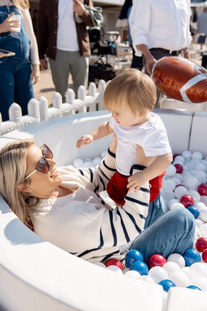 mom and son in ball pit
