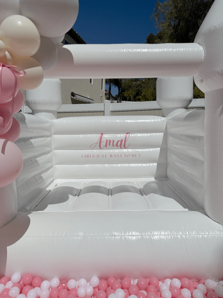Bounce house with "amal" graphic