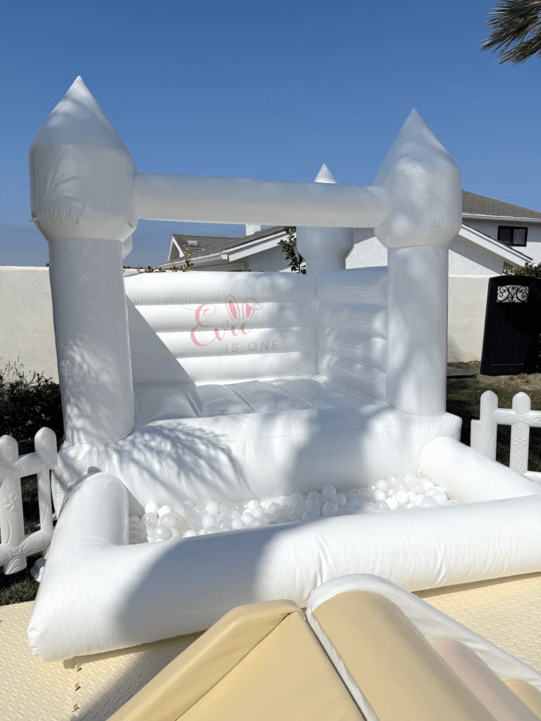 Garden Bunny First Birthday Party in Capistrano Beach 3 White Bounce House